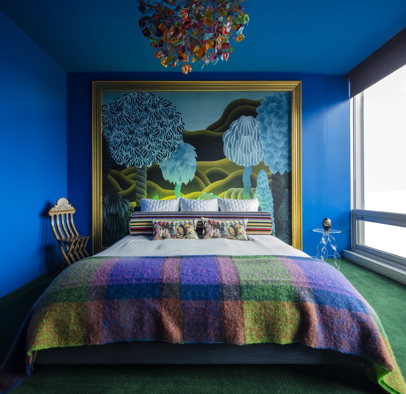 Large spacious blue bedroom by Jasmin Reese Interior Design in Chicago