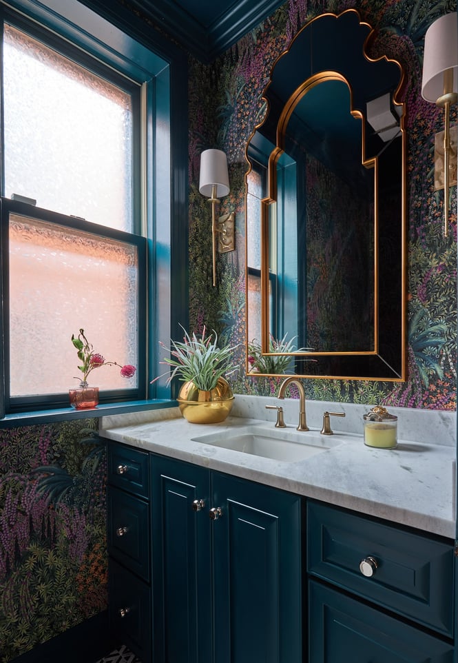 A small powder room sink with turquoise and pink floral wallpaper - bathroom designed by Jasmin Reese Interiors, Chicago.