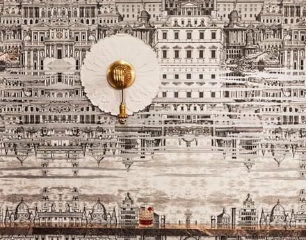 An ornate wall sconce against 