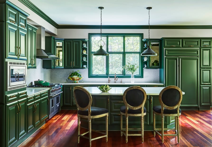 A large, open kitchen designed by Jasmin Reese with bright green cabinetry, Chicago. 