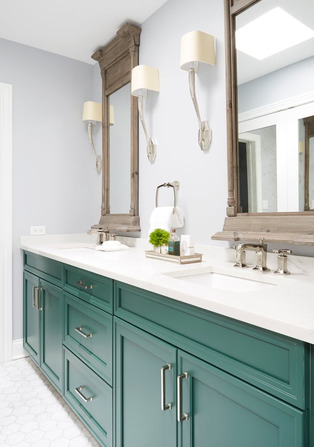  A double sink vanity with bright green cabinetry & brass hardware - bathroom design by Jasmin Reese, Chicago.