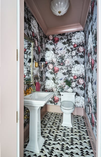 A metallic peach & black powder room designed by Jasmin Reese with foil floral wallpaper, Chicago. 