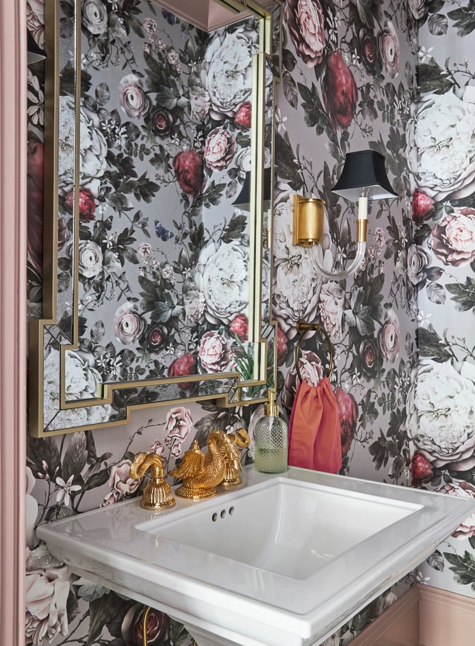 Detail of the sink fixture & mirror in a powder room designed by Jasmin Reese with foil floral wallpaper, Chicago. 
