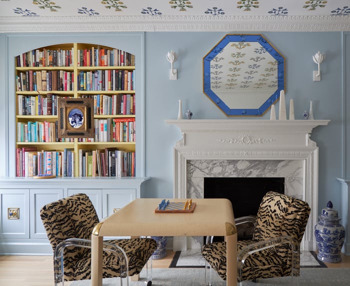 Leopard Print chairs in front of a marble fireplace - living room design by Jasmin Reese Interiors, Chicago, USA. 