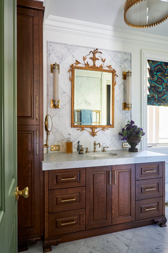 A traditional bathroom vanity sink designed by Jasmin Reese with custom oak cabinetry, Chicago. 