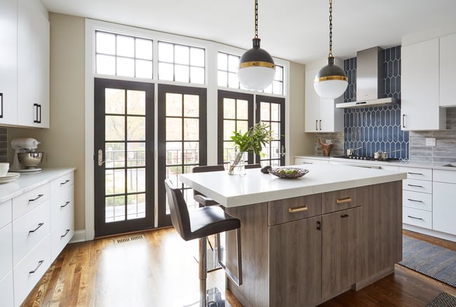 A large open modern kitchen designed by Jasmin Reese with blue subway tile backsplash, Chicago. 