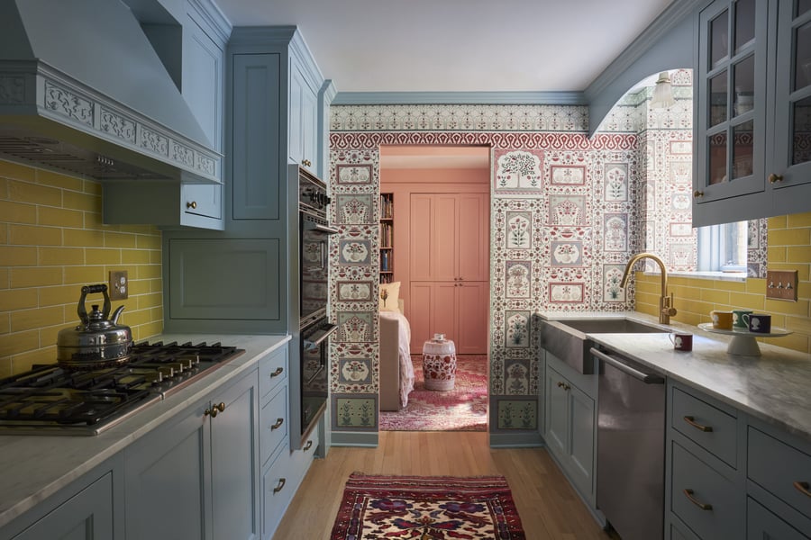 A bright powder blue and marble kitchen designed by Jasmin Reese, Chicago. 