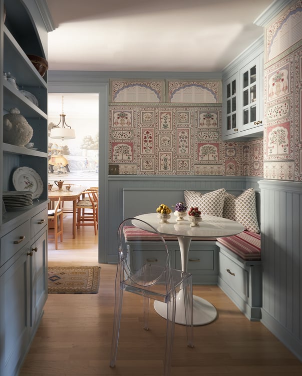 A powder blue kitchen nook designed by Jasmin Reese with French pink wallpaper.