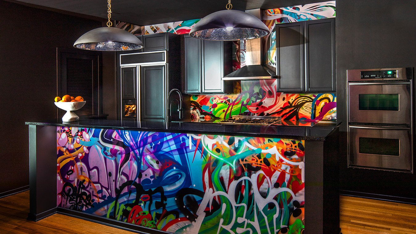 A black kitchen designed by Jasmin Reese with graffiti in bright colors, Chicago. 