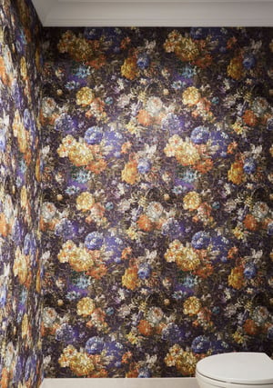 Orange, black, purple, and blue foil wallpaper in a bathroom designed by Jasmin Reese, Chicago. 