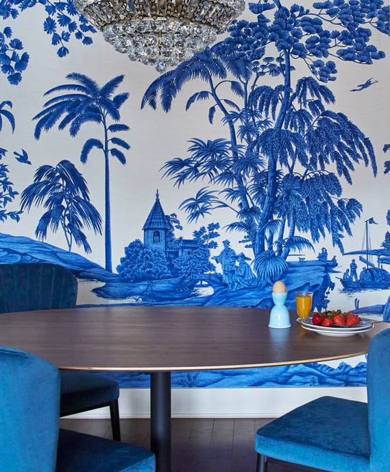 A dining room design by Jasmin Reese based on Blue Willow pattern wallpaper with chairs to match, Chicago. 