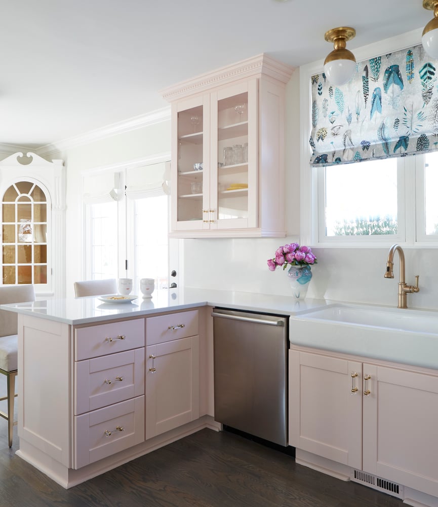 A bright traditional kitchen designed by Jasmin Reese with soft pink and white, Chicago. 