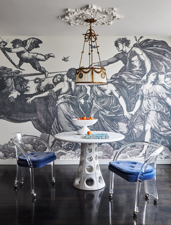 A small blue and white dinette with a scene from Greek mythology in a dining room designed by Jasmin Reese, Chicago. 