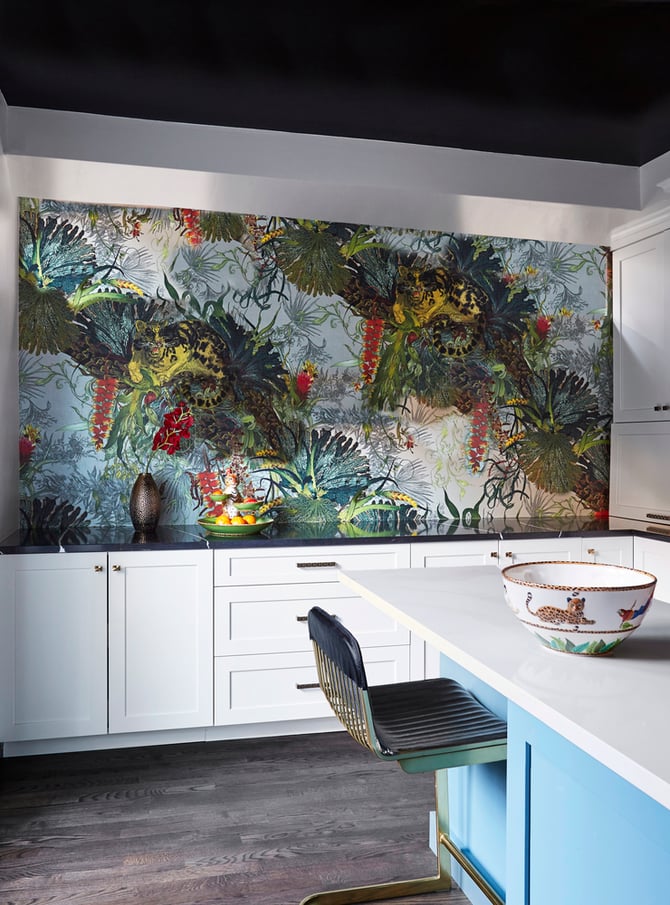 A minimalist kitchen design by Jasmin Reese with a large painting of a jungle scene, Chicago. 
