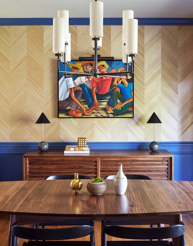 Rustic dining room design by Jasmin Reese: carved wooden sideboard, blue paint, wooden wallpaper, Chicago. 