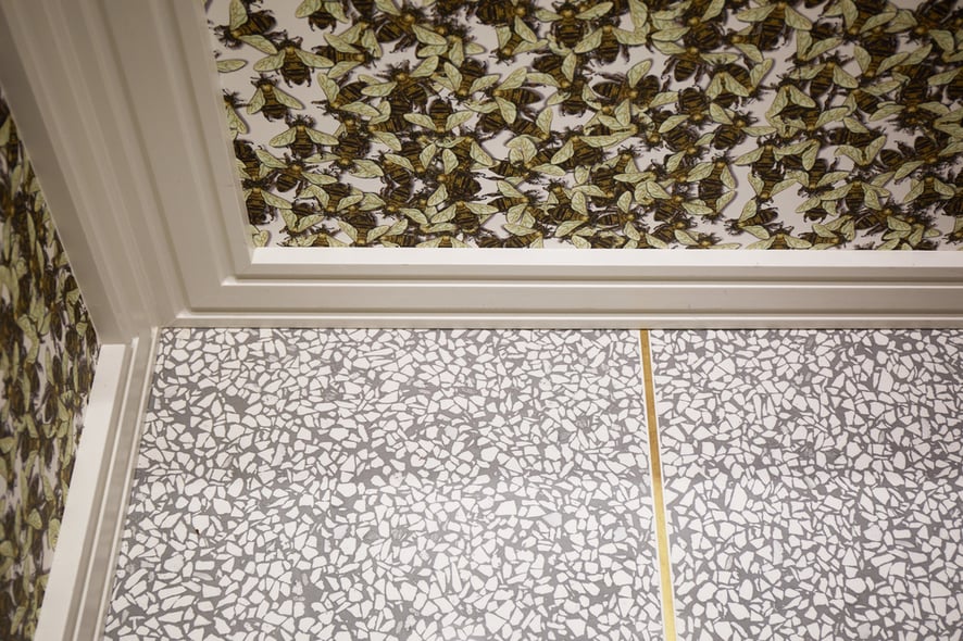 Details of the bee and stone wallpaper used by Jasmin Reese in a private elevator she designed, Chicago. 