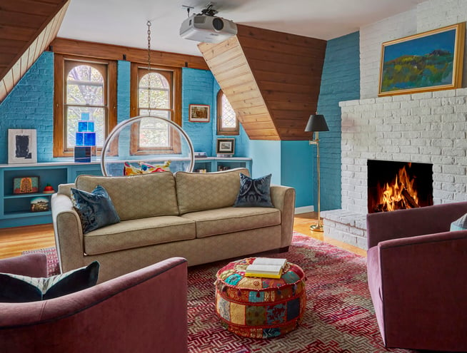 Windows in a game room designed by Jasmin Reese, Chicago: pink, turquoise, wood paneling. 