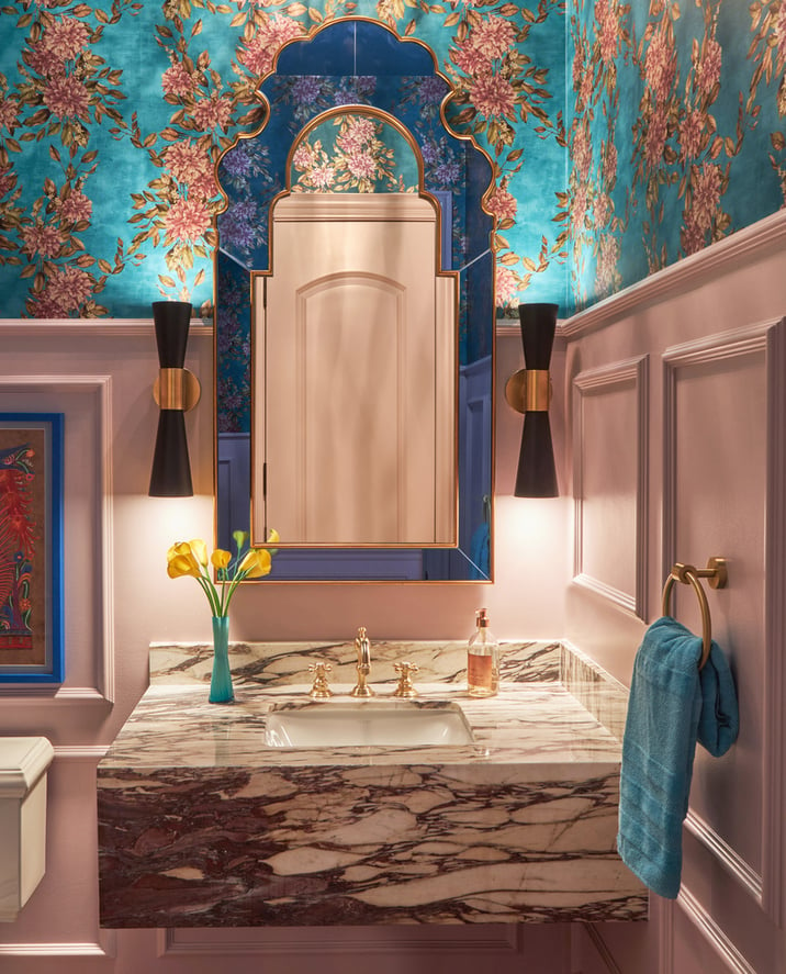A small powder room sink with turquoise and pink floral wallpaper designed by Jasmin Reese Interiors, Chicago, USA. 
