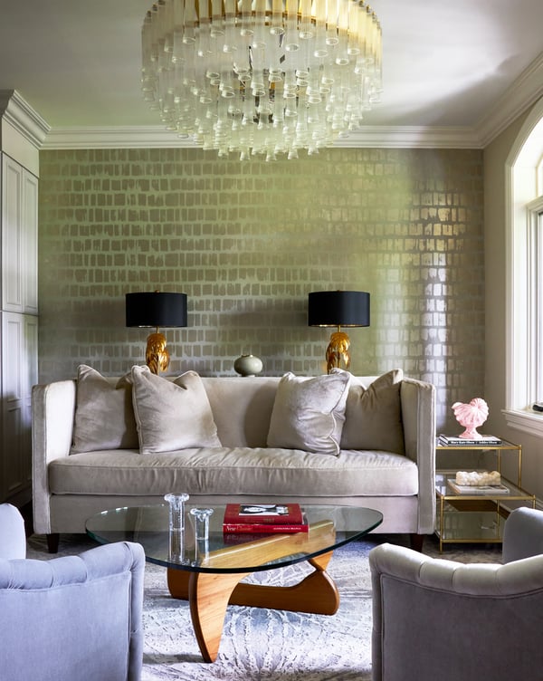 A small living room with a cream sofa and grey circular armchairs against green and gold foil wallpaper - living room design by Jasmin Reese Interiors, Chicago, USA. 