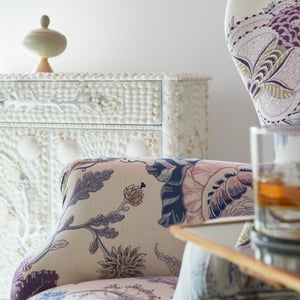 Floral upholstery in pinks and blues with a sea shell chest - interior design by Jasmin Reese Interiors, Chicago, USA. 