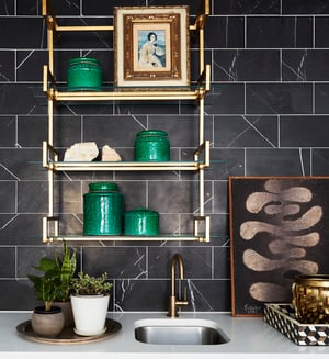 Brass and glass shelving on a wet bar designed by Jasmin Reese: marble tile and countertops, Chicago. 