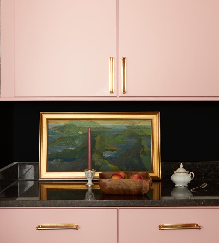 A pink, gold, and black kitchen detail designed by Jasmin Reese, Chicago. 