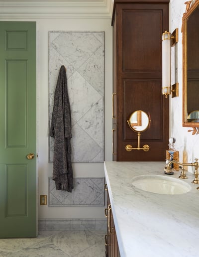 A side view of a bathroom vanity sink designed by Jasmin Reese with custom oak cabinetry & marble, Chicago. 