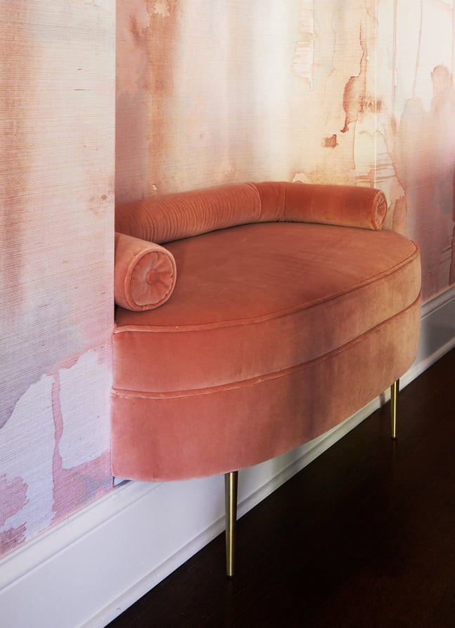A detail of an inset peach velvet bench in a dining room design by Jasmin Reese, Chicago. 