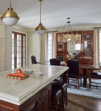 Large marble top island in a kitchen and dining room designed by Jasmin Reese, Chicago. 
